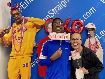 Team members in costumes celebrate Valentine's Day at Emerson Orthodontics office event.