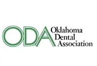 Oklahoma Dental Association logo with green lettering and text.